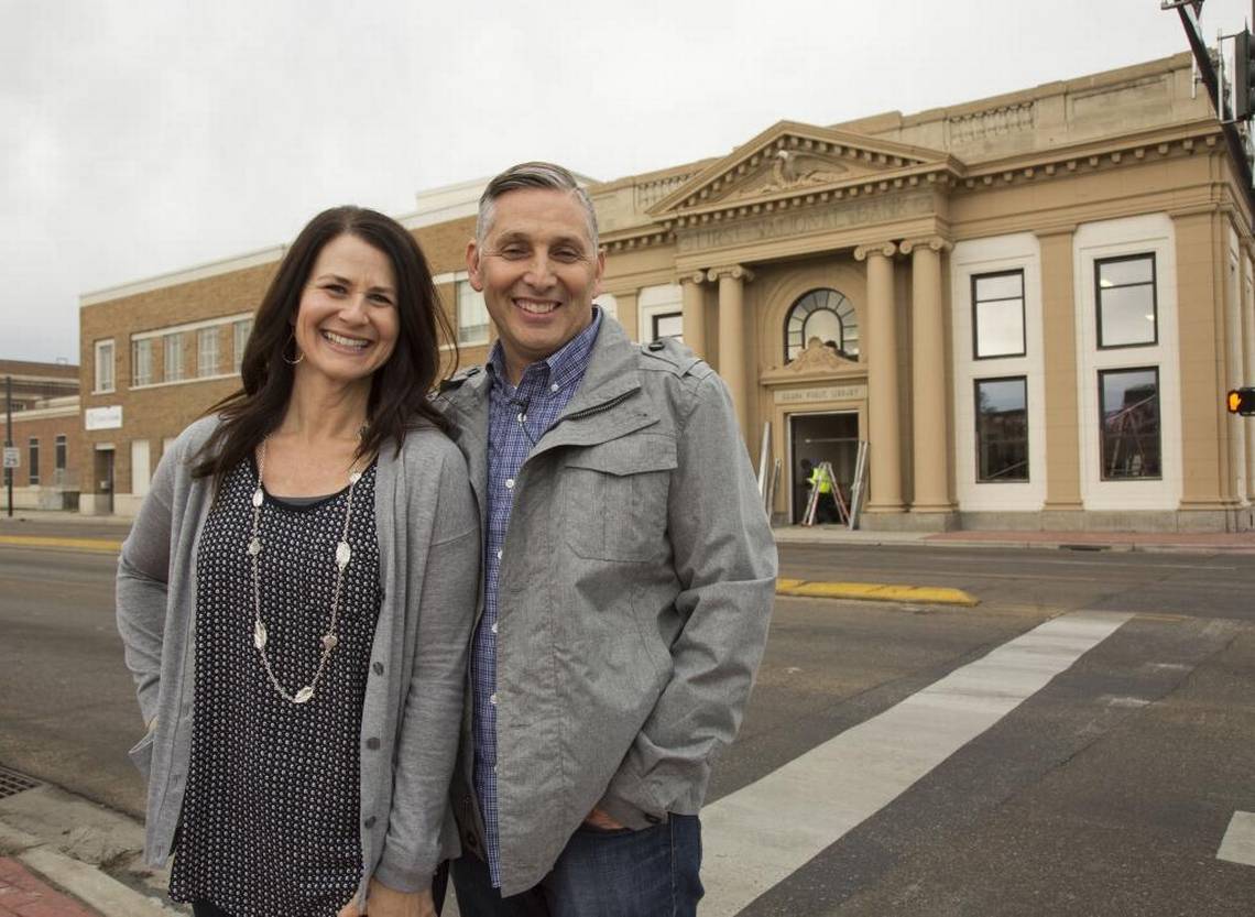 Photo of Mike and Patty Mussell, Mussell Construction owners in front of the Old Library